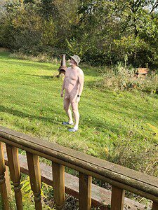 Naturist nudist nude naked penis enjoying outdoor naturist lifestyle.