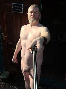 Naturist nudist nude naked penis man taking selfie outdoors.